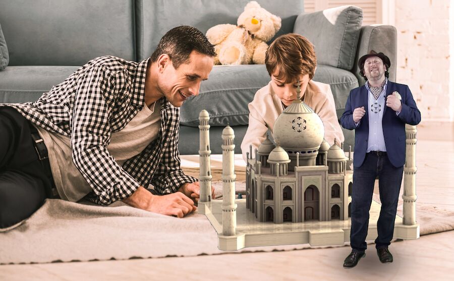 Family at home watching an AR guide beside a 3D model of the Taj Mahal